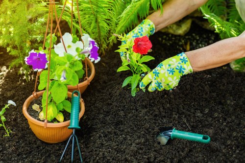 Gardener wearing protective equipment during safe outdoor maintenance