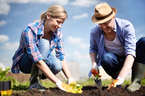 Gardeners working on a well-kept Tower Hill outdoor space