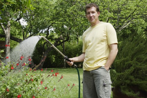 Overgrown garden clearance in Tower Hill with debris removal